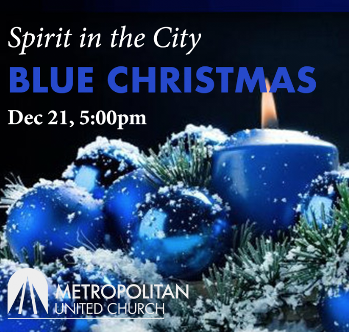 photo of blue christmas decorations and a light blue candle