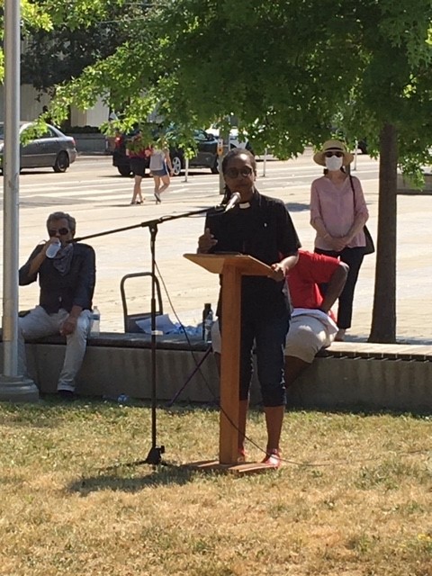 Rev. Maya Douglas speaks at a rally to resist racism 