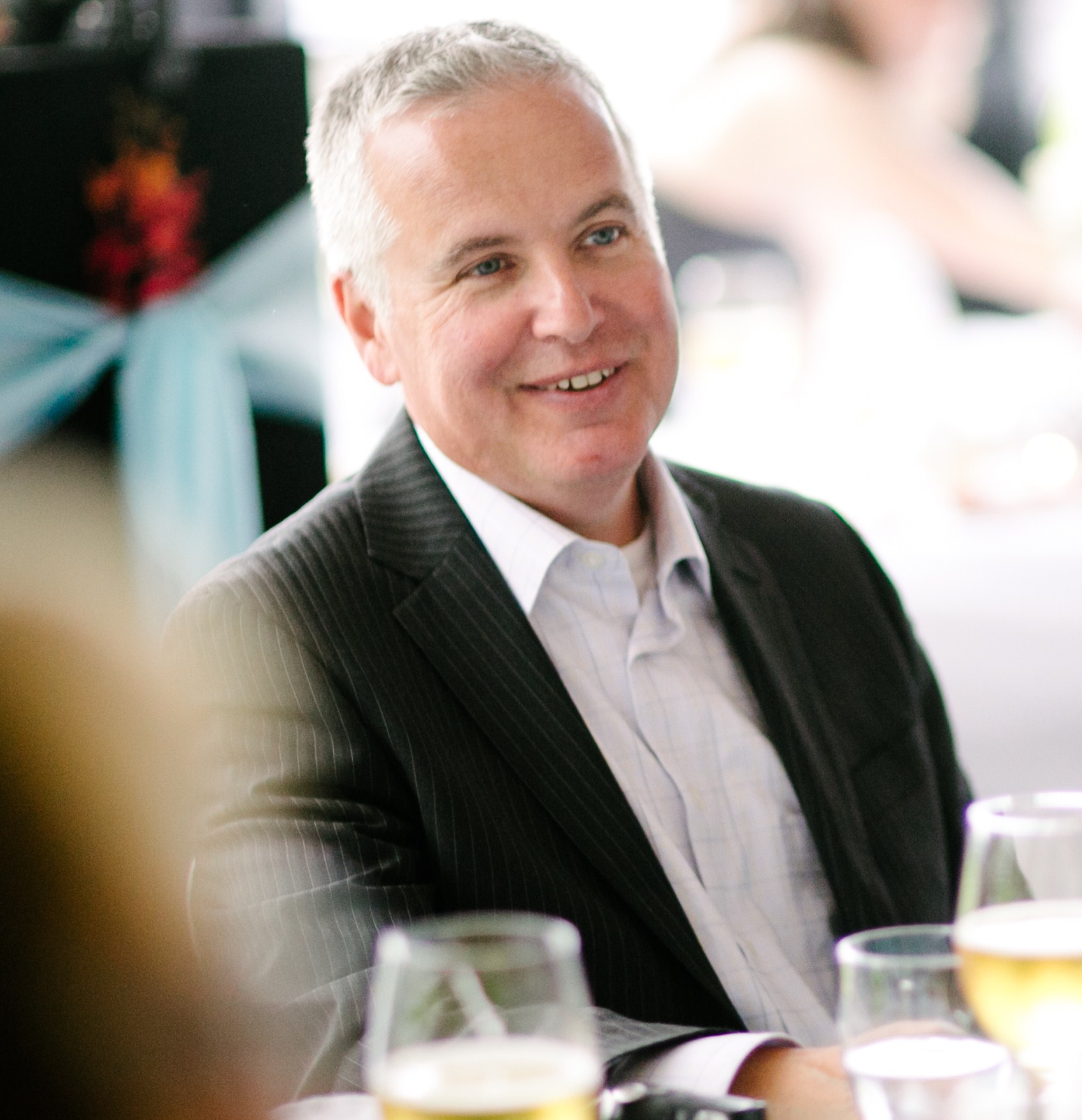 Kevin Moore sitting at a wedding dinner table