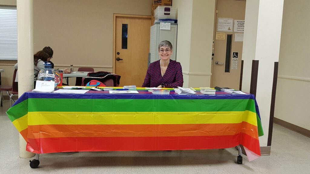 person behind a display table 