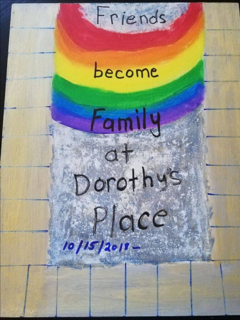 Banner that reads become friends become family at Dorothy's place