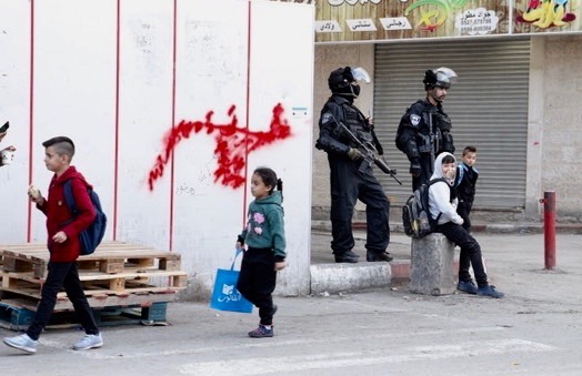 photo of children and some armed guards